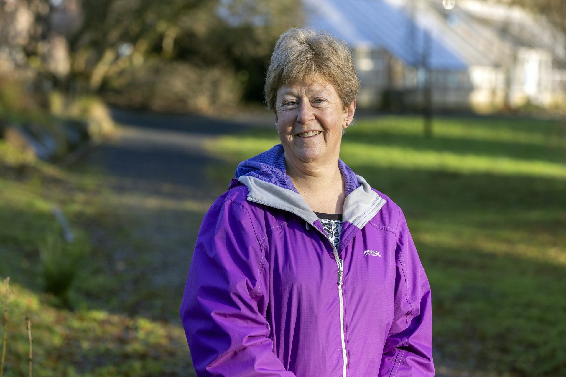 Women sitting on a red tractor.
