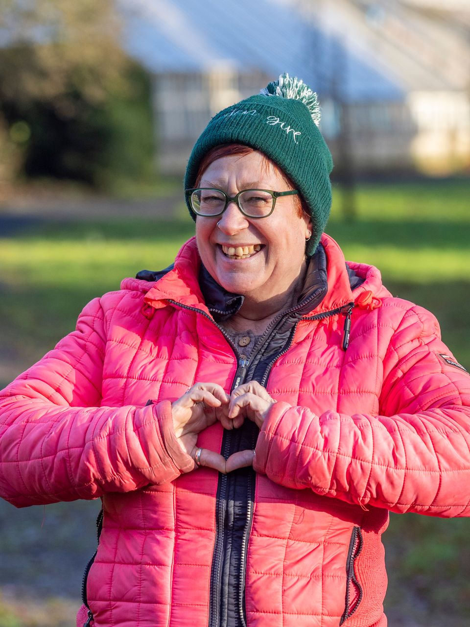 Picture of woman in the garden smiling to camera