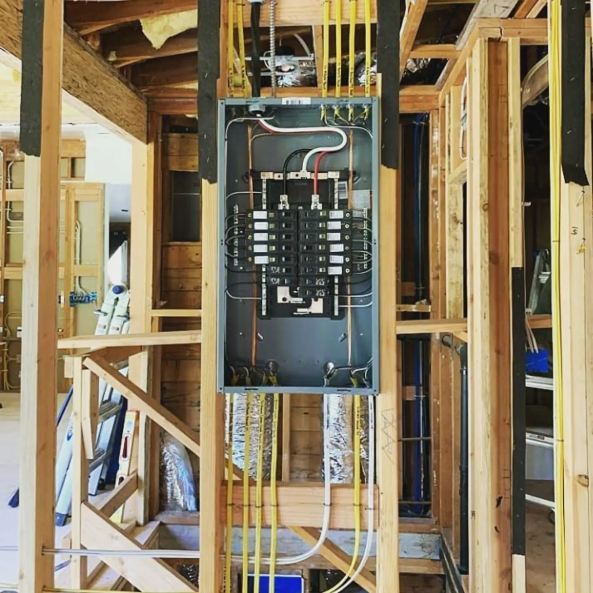 Panther City Electric LLC - An electrical box is hanging from the ceiling of a house under construction