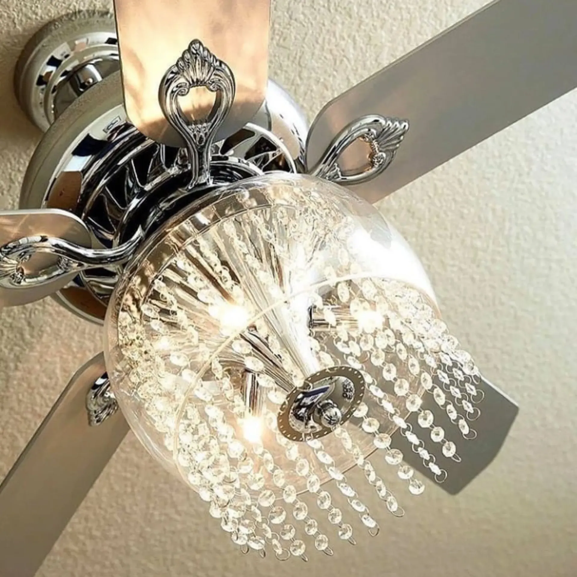 Panther City Electric LLC - A ceiling fan with a chandelier attached to it