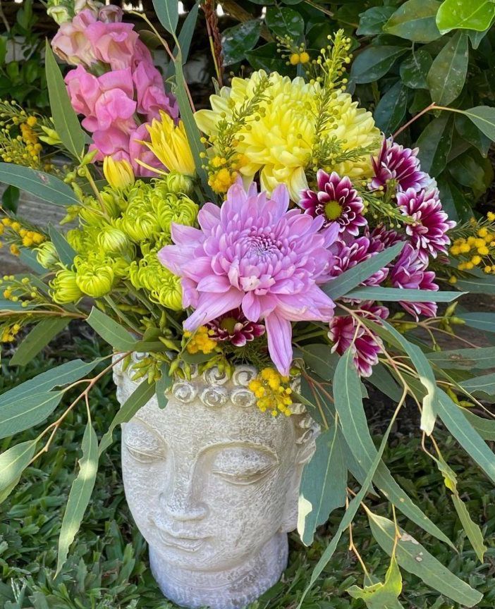 Pink And Green Flowers Placed On A Head Vase — The House of Flowers In Kirwan, QLD