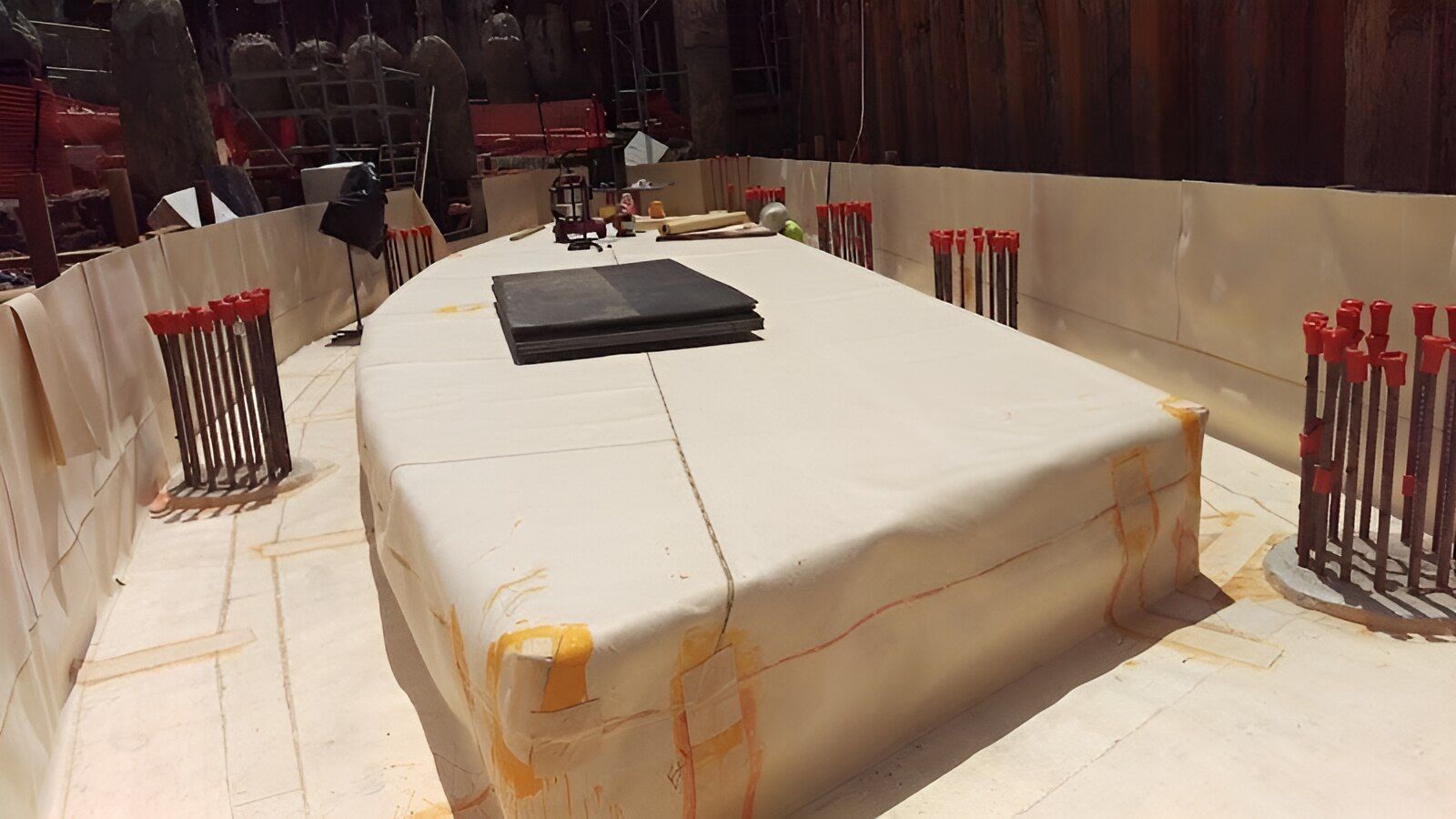 A Large White Table With A Book On Top Of It — Eldred Waterproofing In Cairns, QLD