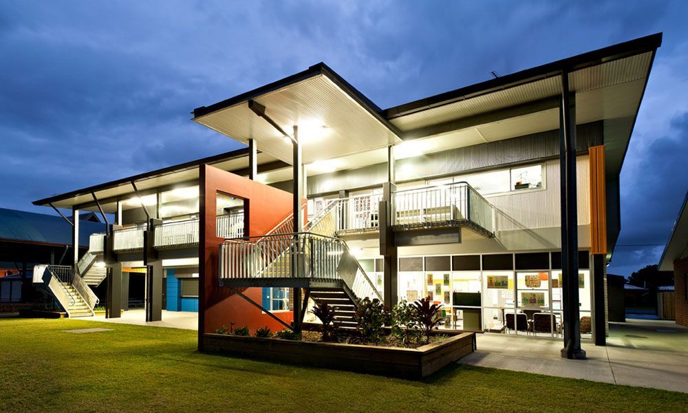 Two-story Modern Building With Overhanging Roof and Exterior Stairs — BOLD Architecture + Interior Design In Mackay, QLD