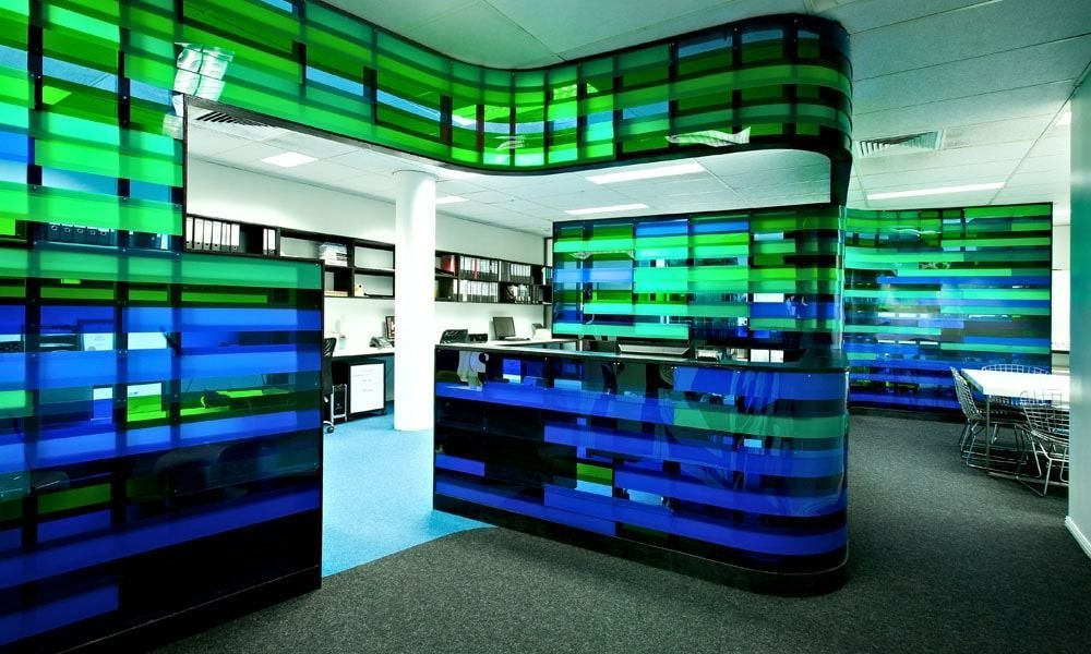 Office space with blue and green translucent walls and a reception desk — BOLD Architecture + Interior Design In Mackay, QLD