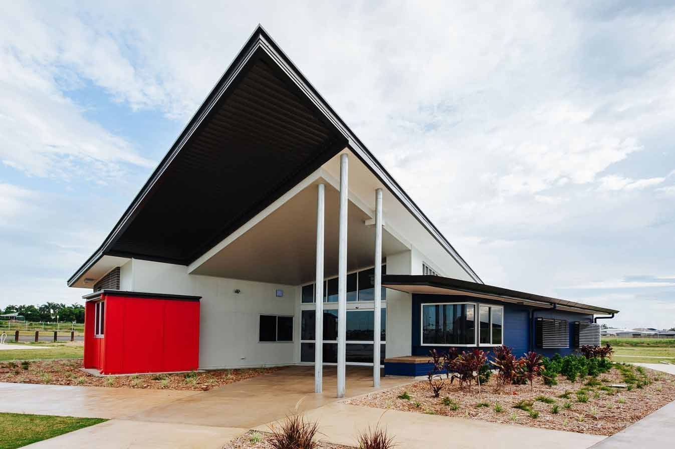 A Red White And Blue Building With A Triangle Shaped Roof — BOLD Architecture + Interior Design In Mackay, QLD