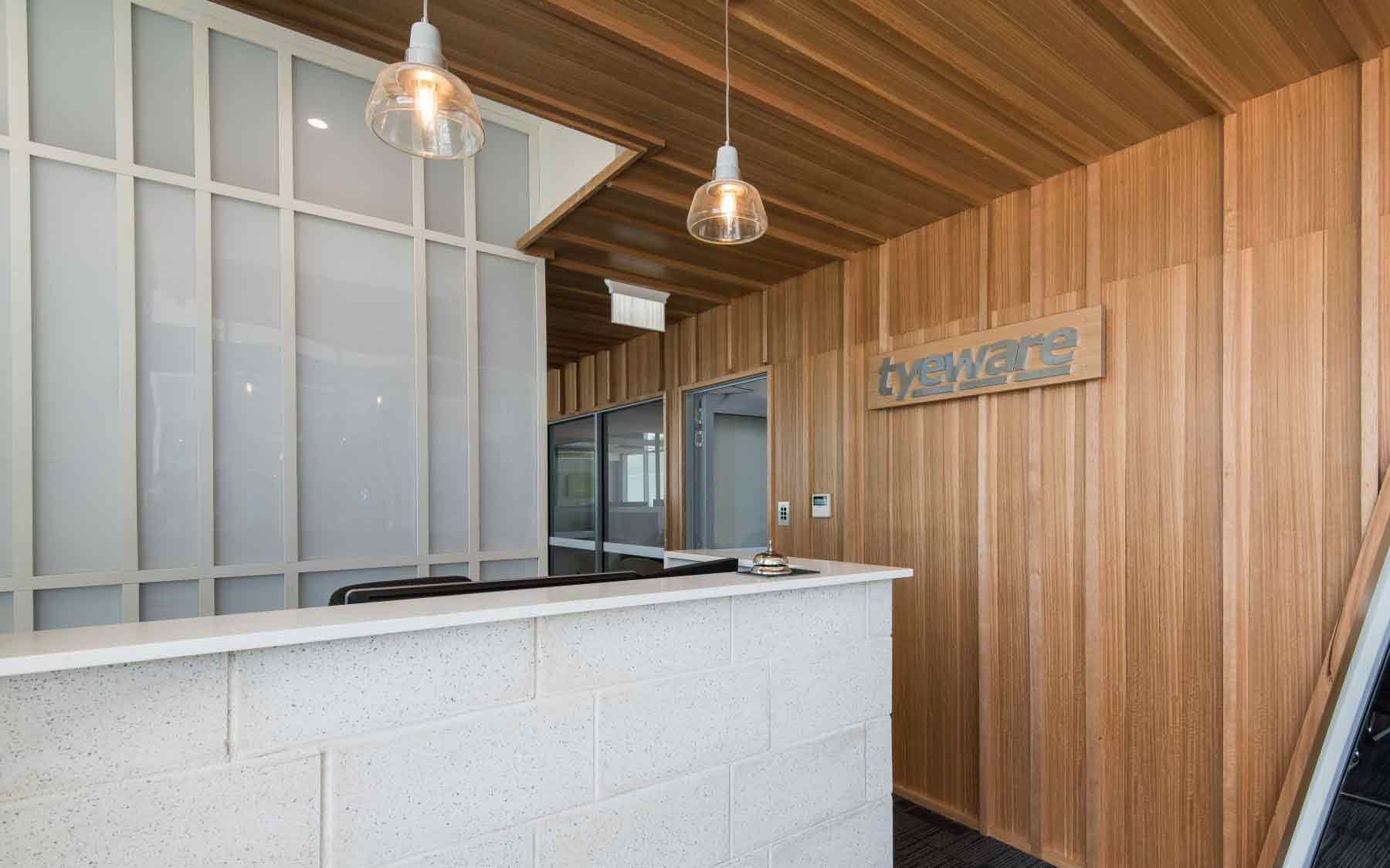 There Is A Reception Desk In The Middle Of The Room — BOLD Architecture + Interior Design In Mackay, QLD
