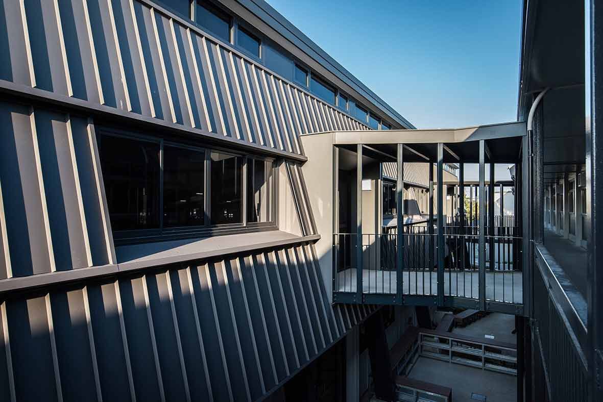 An Aerial View Of A Building With A Bridge Between Two Buildings — BOLD Architecture + Interior Design In Mackay, QLD