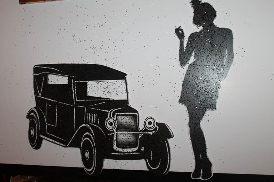 Black silhouette of vintage car and woman on white background.