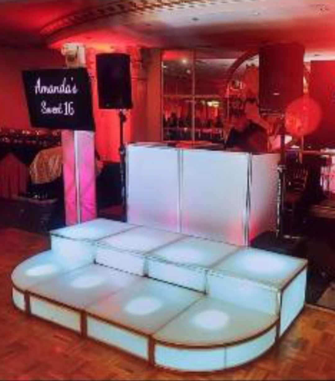 Lit-up DJ booth with 