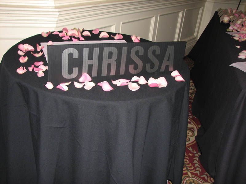 Black table with a sign that reads 