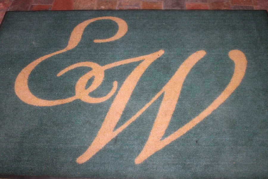 Green doormat with gold intertwined 