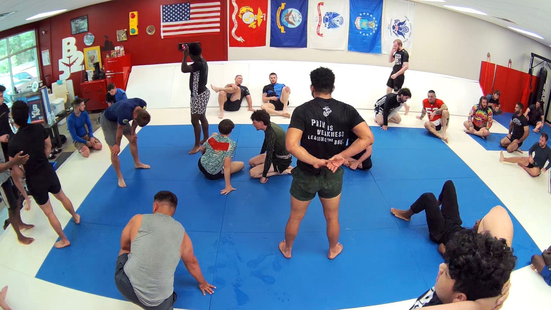 Adults practicing Brazilian Jiu-Jitsu drills at B-52 Jiu-Jitsu Academy in Perry, GA to build focus.
