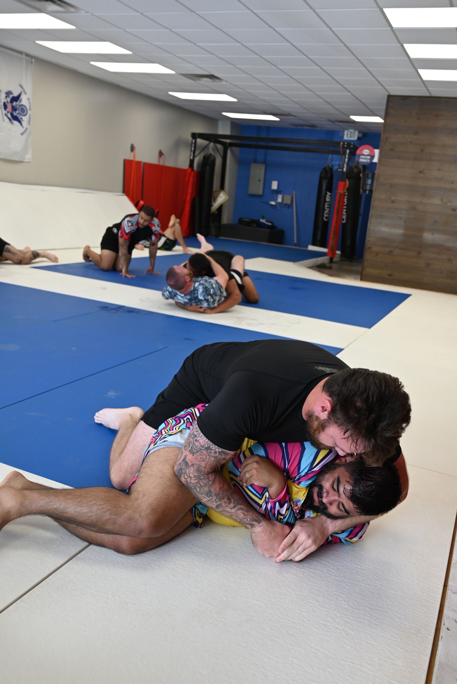 Adults drilling a beginner jiu-jitsu technique at B-52 Jiu-Jitsu Academy in Perry, GA, building confidence.