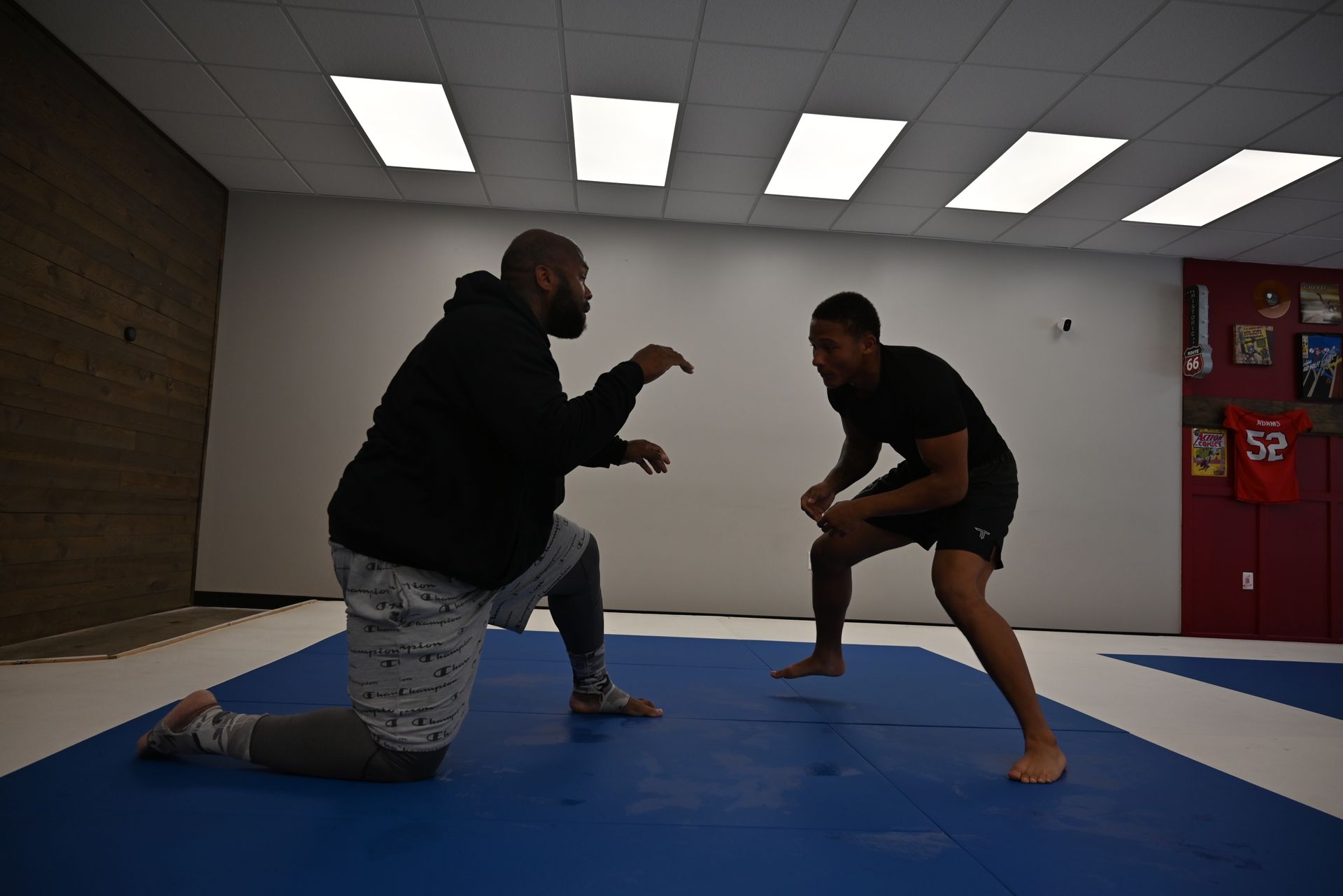 Adult students drilling Brazilian Jiu-Jitsu partner techniques at B-52 Jiu-Jitsu Academy in Perry, GA for confidence.