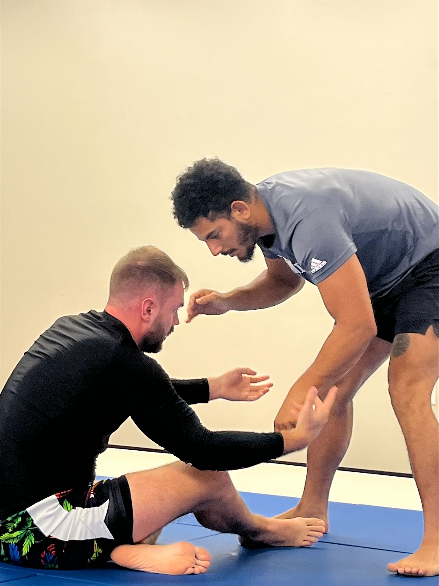 Adults practicing Brazilian Jiu-Jitsu technique at B-52 Jiu-Jitsu Academy in Perry, GA for fitness and confidence