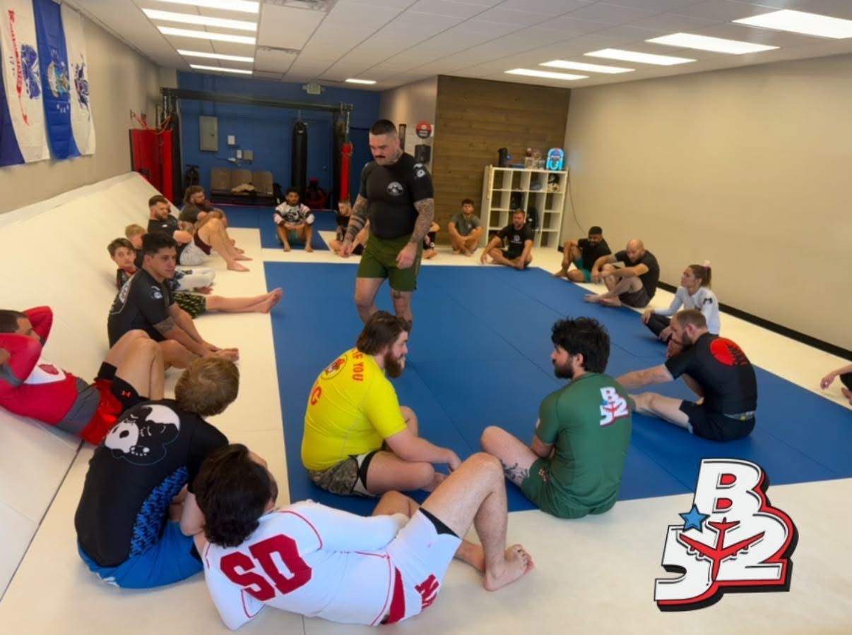 Adults training and partnering on the mats at B-52 Jiu-Jitsu Academy in Perry, GA, building friendships
