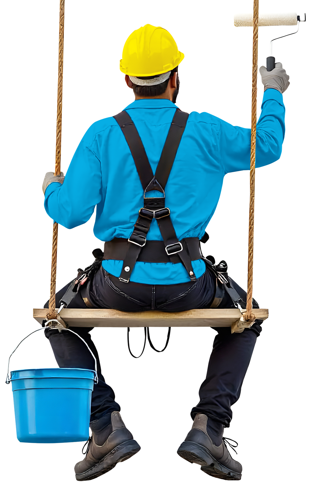 Pintor con casco amarillo y camisa azul pintando sentado en un columpio; cubo azul.