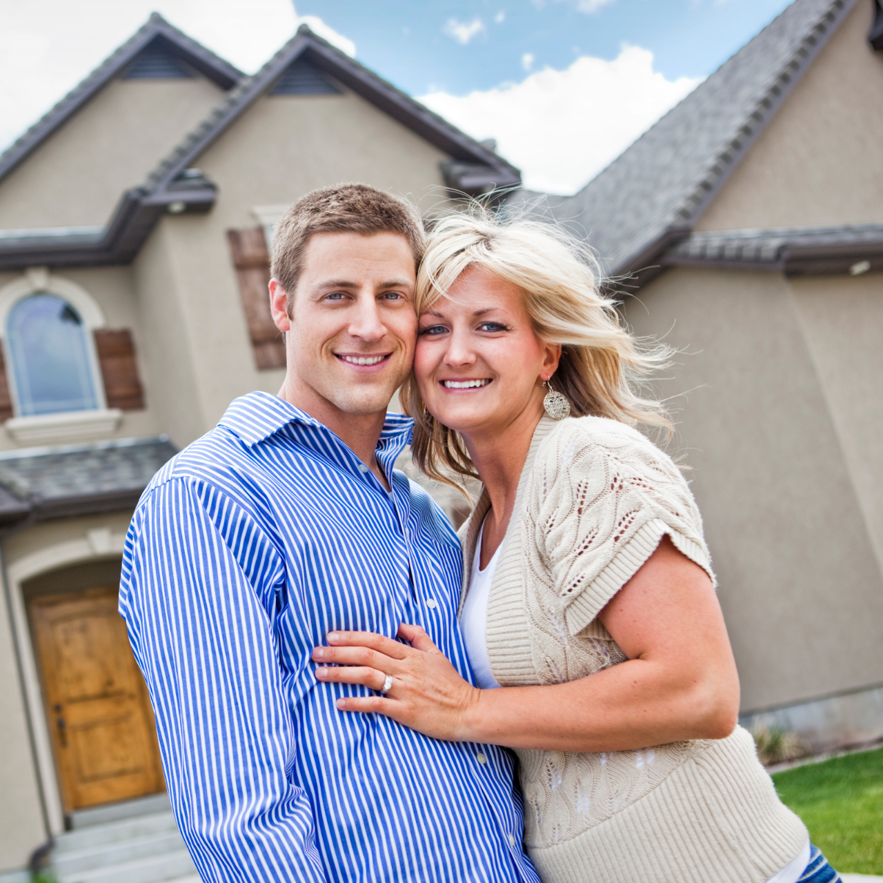 Family of four outside a house; mother holds hands with daughter, father carries son on shoulders.