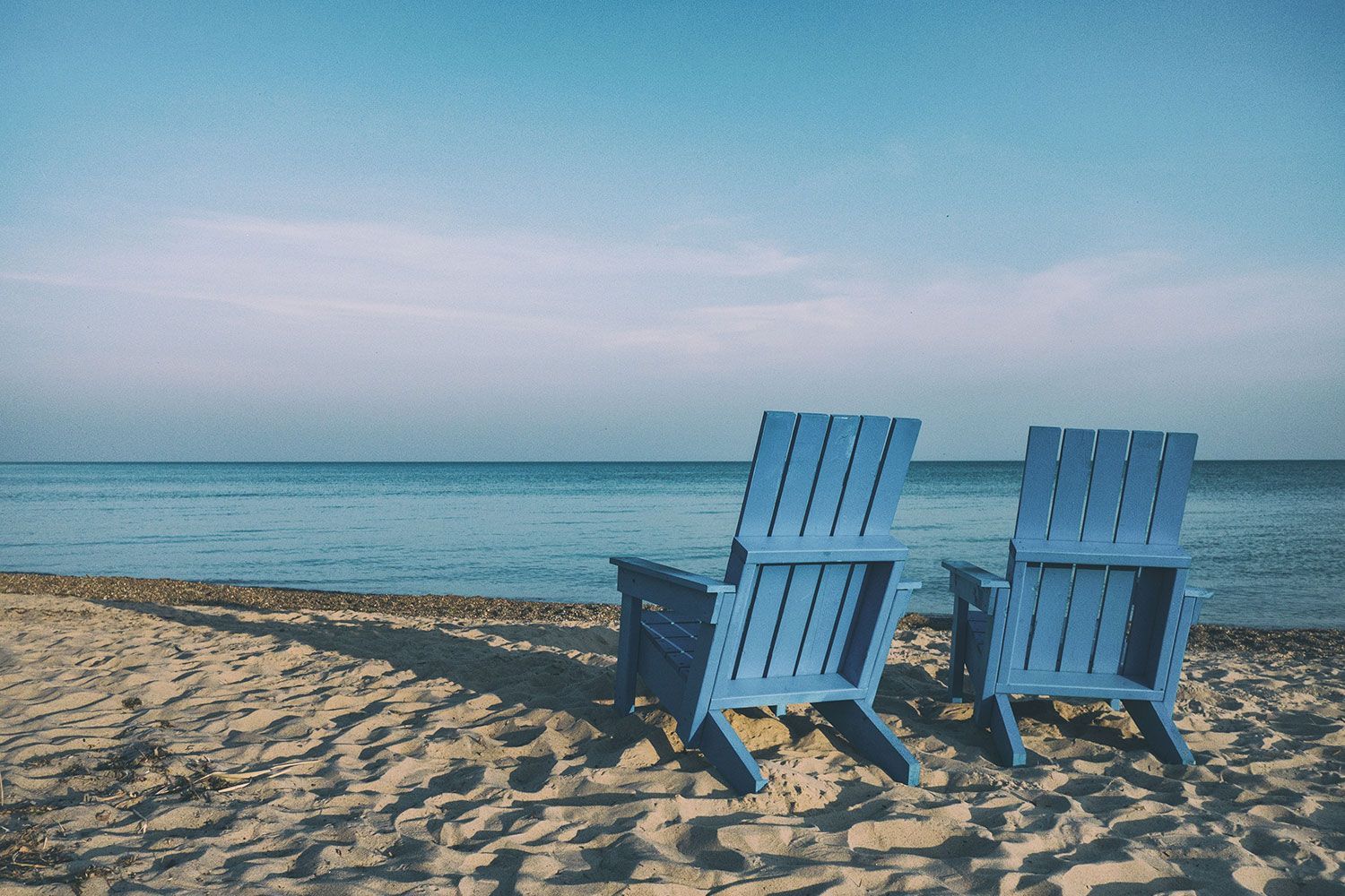 Two chairs on a beach