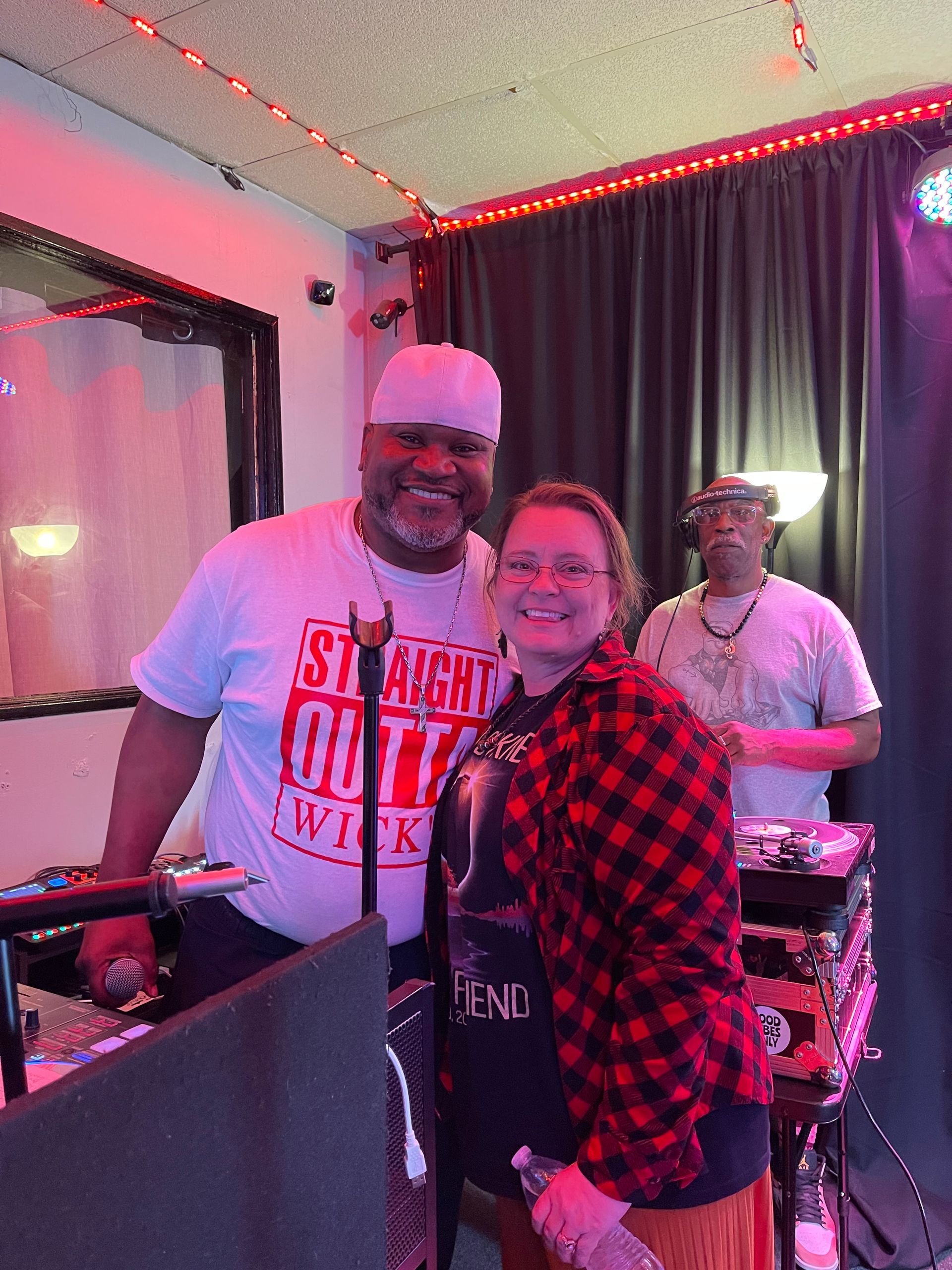 A man and a woman are posing for a picture in a room.