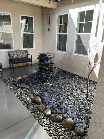 There is a fountain in the middle of the courtyard.
