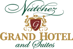 Logo for Natchez Grand Hotel and Suites with decorative script and emblem.