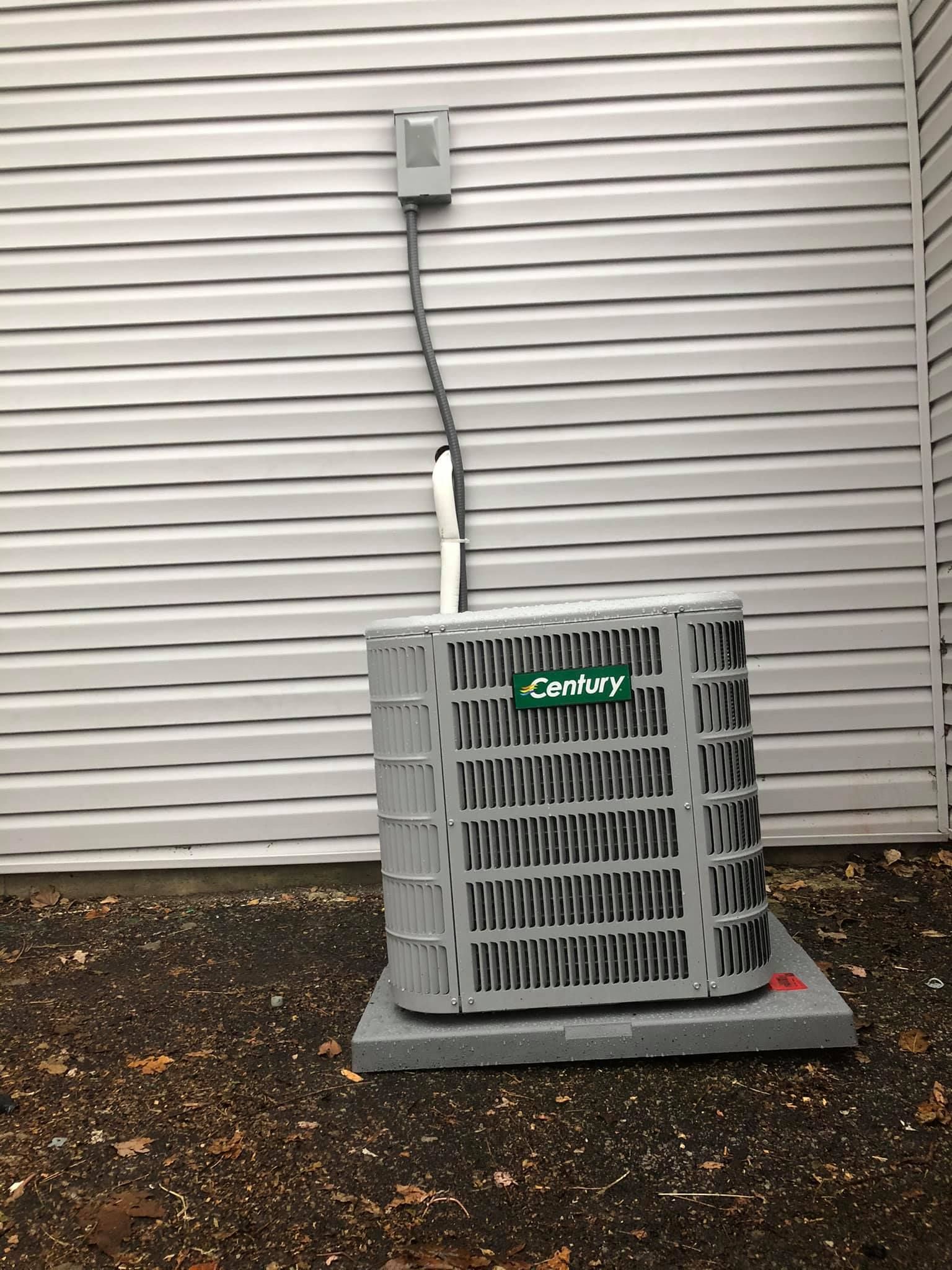 Century HVAC unit installed on concrete pad for residential air conditioning