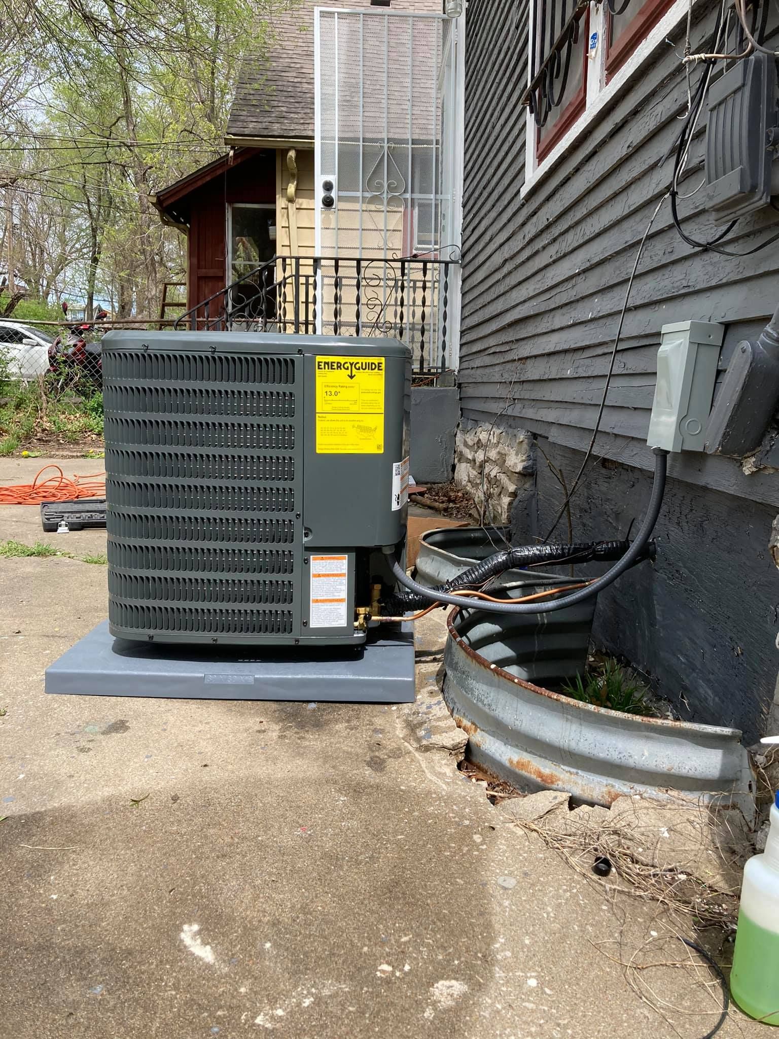 Side view of Goodman HVAC installation with insulated refrigerant lines