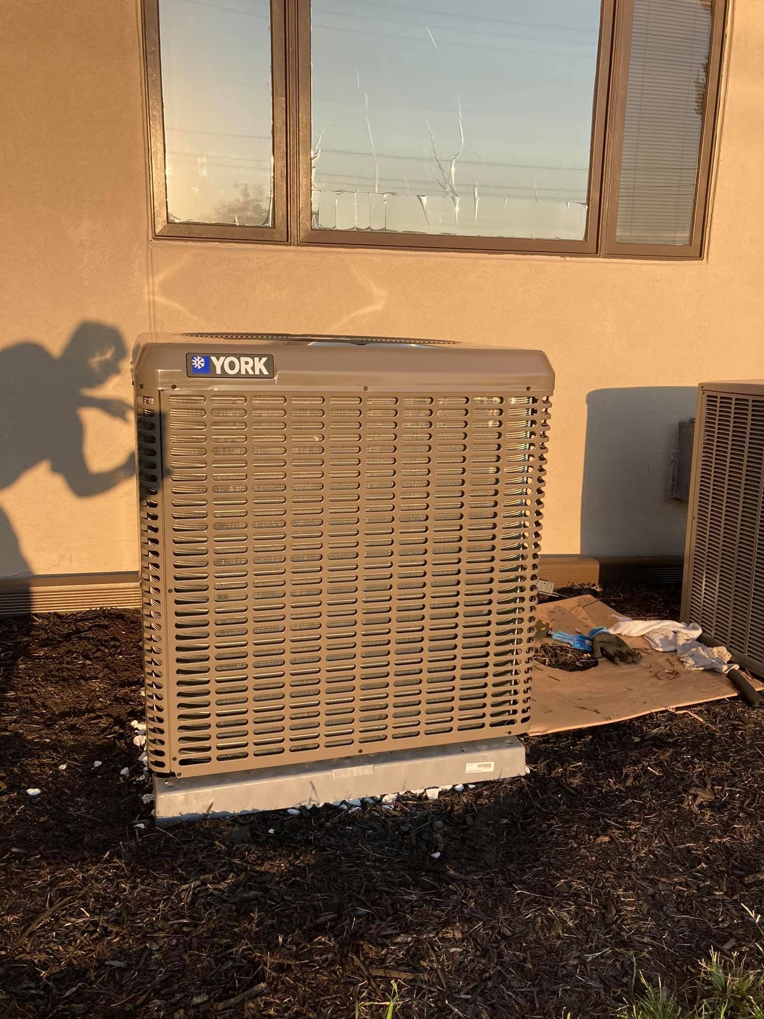 Outdoor York air conditioning unit installed for residential cooling system
