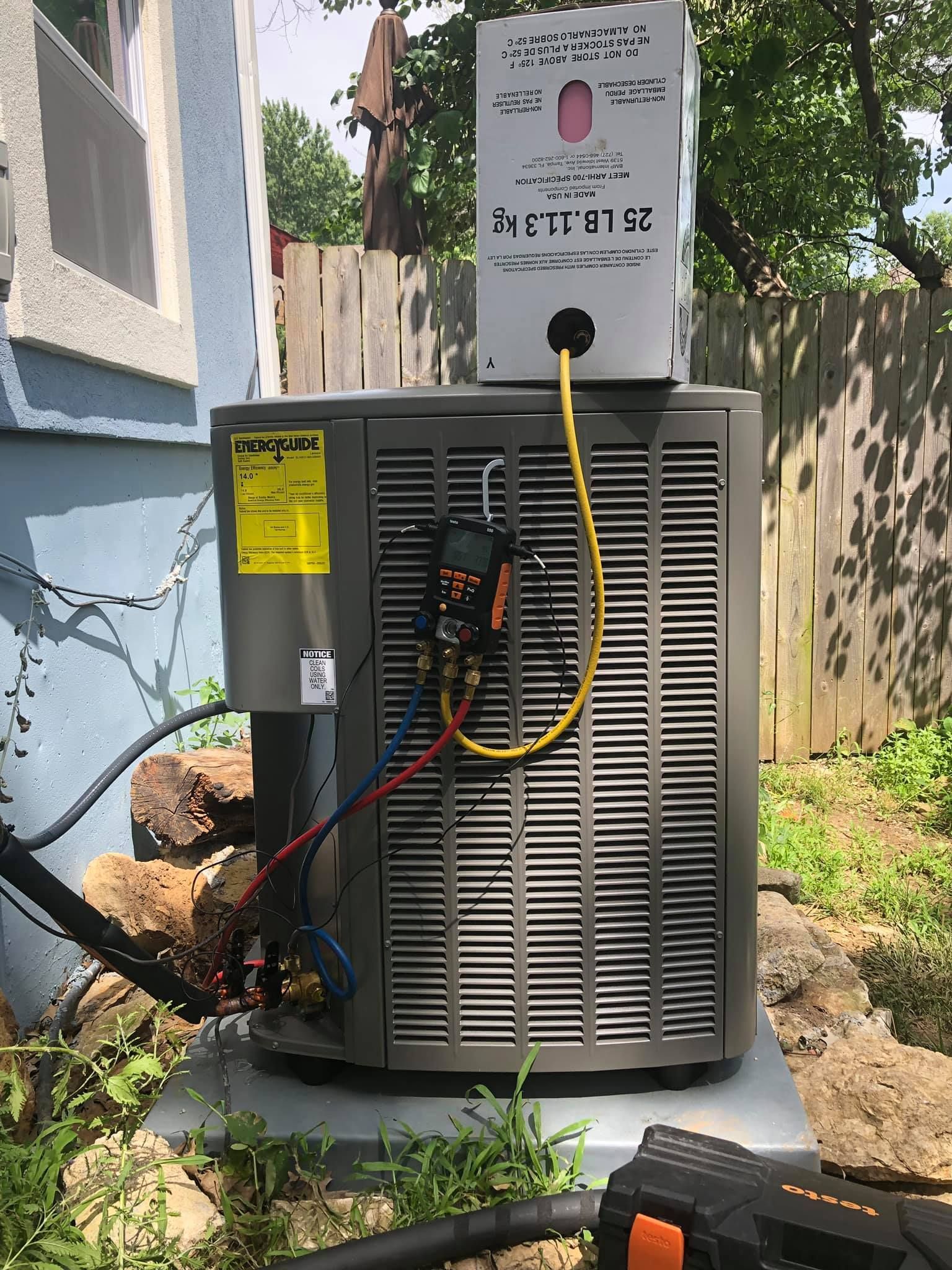 HVAC system refrigerant recharge with gauge and R410A tank setup