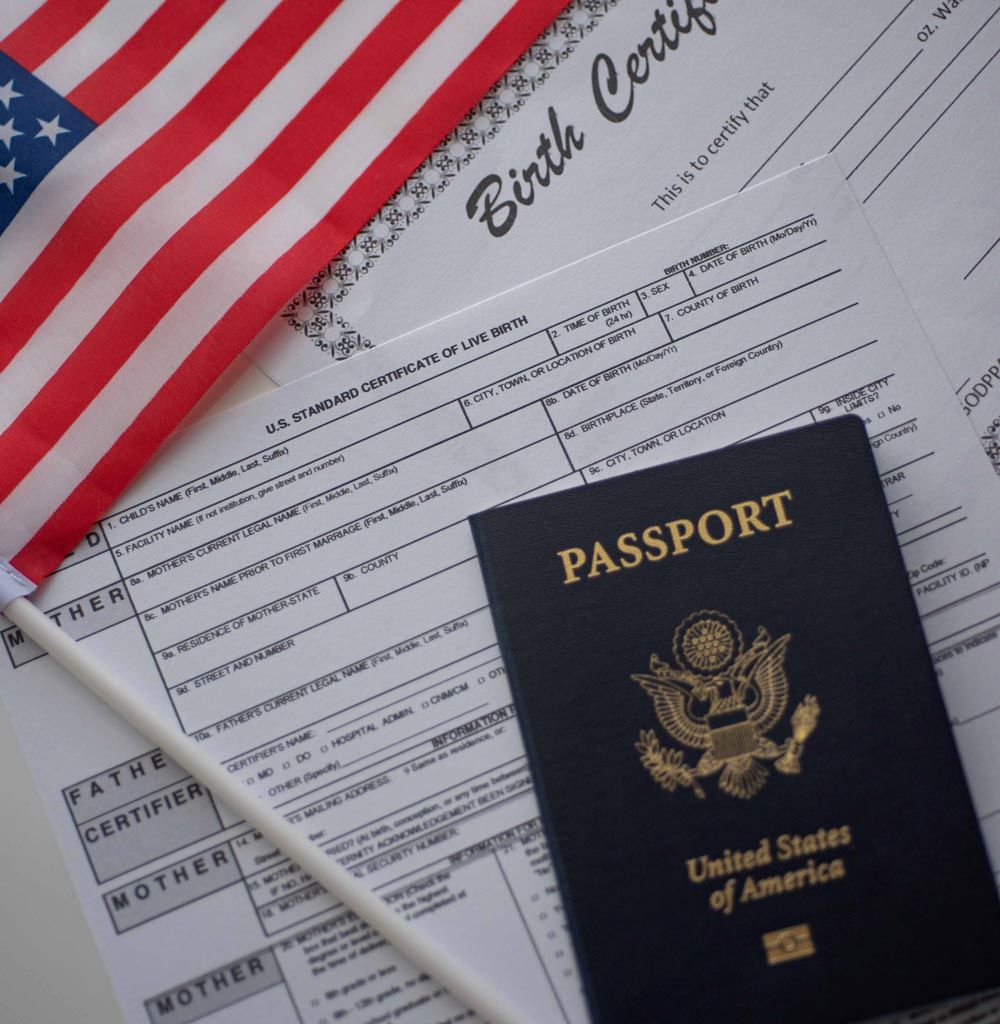 American flag, passport, and birth certificate on a white surface, symbolizing US citizenship. American flag, passport, and birth certificate on a white surface, symbolizing US citizenship.