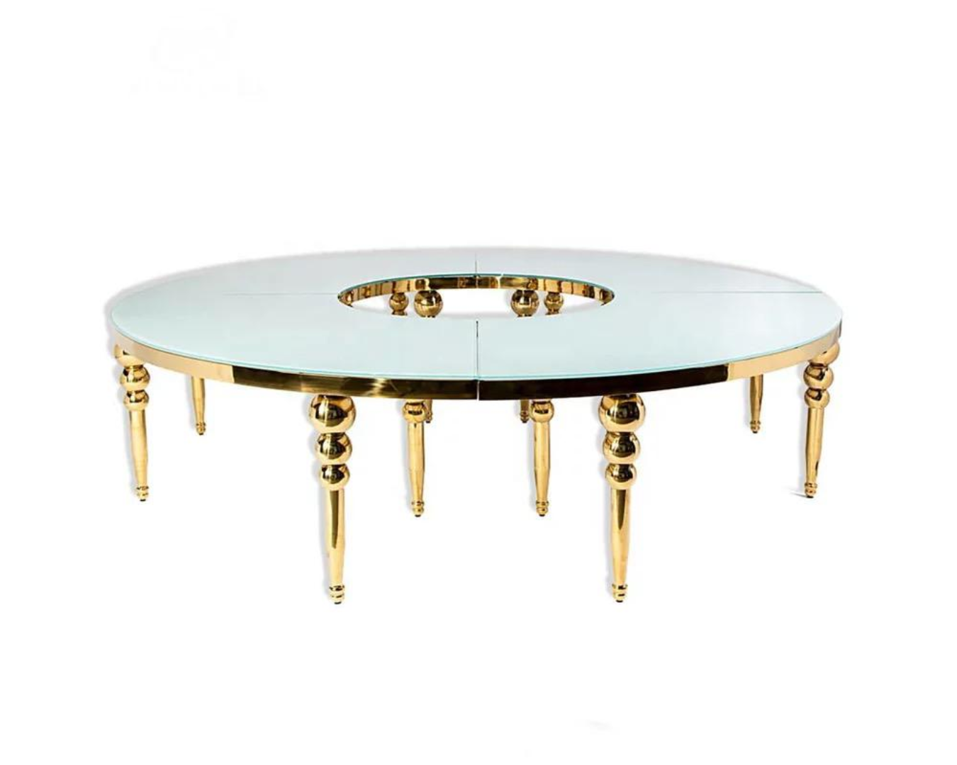 A round table with gold legs and a white top on a white background.