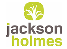 A logo for jackson holmes with a tree in the center