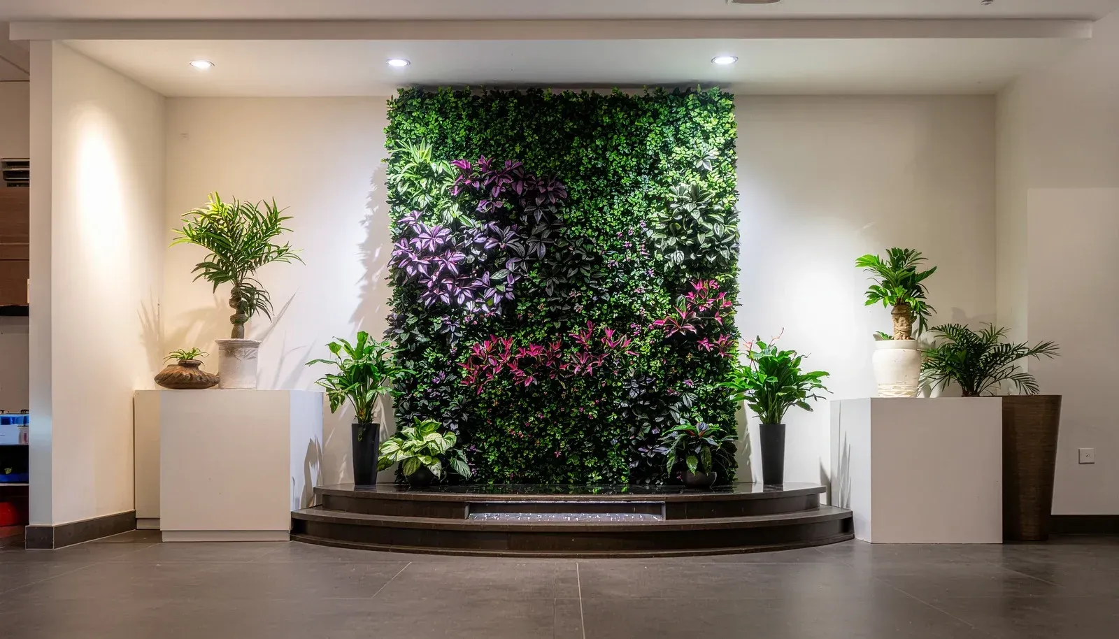 Rows of red flowering plants with green foliage in a garden shop.