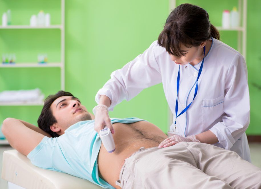 doctor doing the checks on a man for Urological Conditions