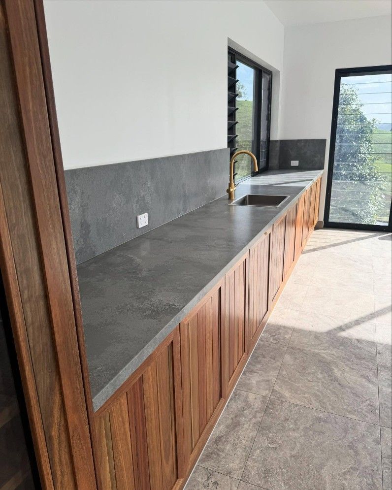 A Kitchen With White Cabinets, Stainless Steel Appliances — Elite Stone in Tweed Heads South, NSW