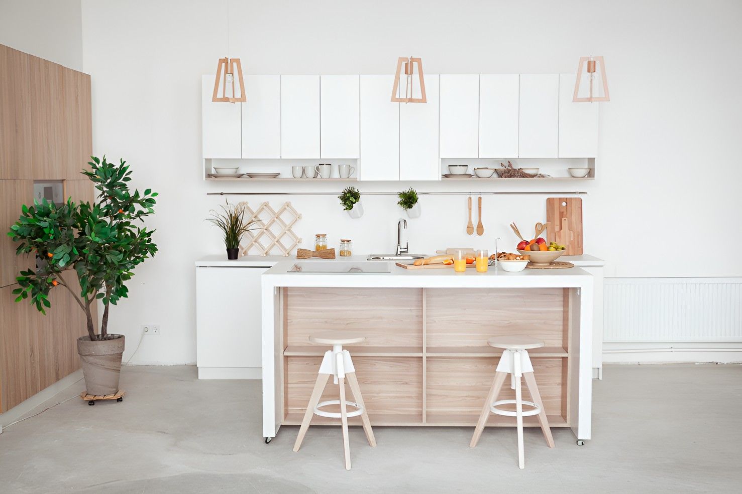 A Modern Kitchen With White Cabinets and Wooden Stools — Elite Stone in Gold Coast, QLD