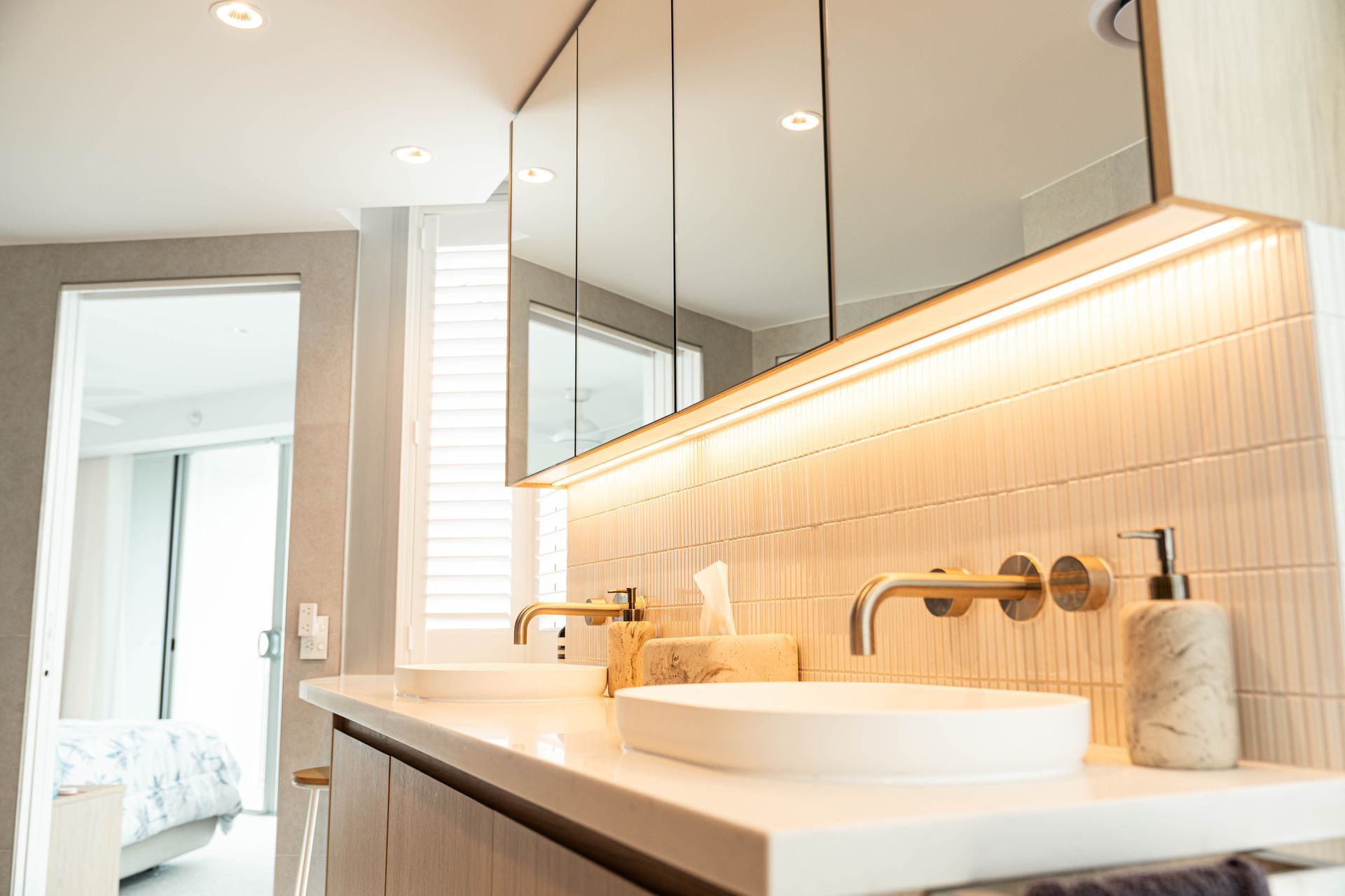 Modern Bathroom Vanity With Double White Sinks, and Brushed Gold Faucets — Elite Stone in Tweed Heads South, NSW