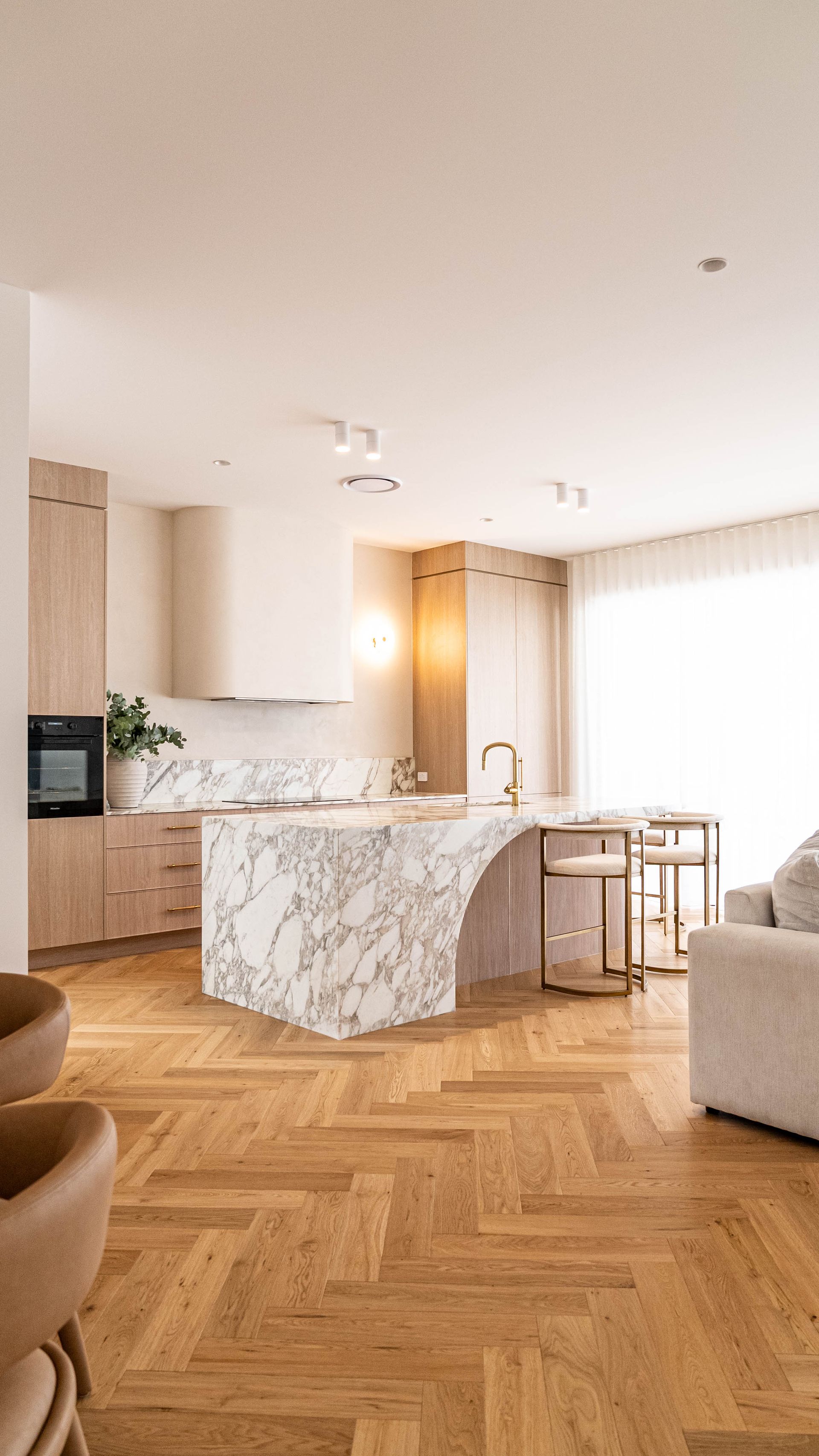 A Modern, Bright Kitchen Featuring a White Marble Island, and Gold Accents — Elite Stone in Tweed Heads South, NSW