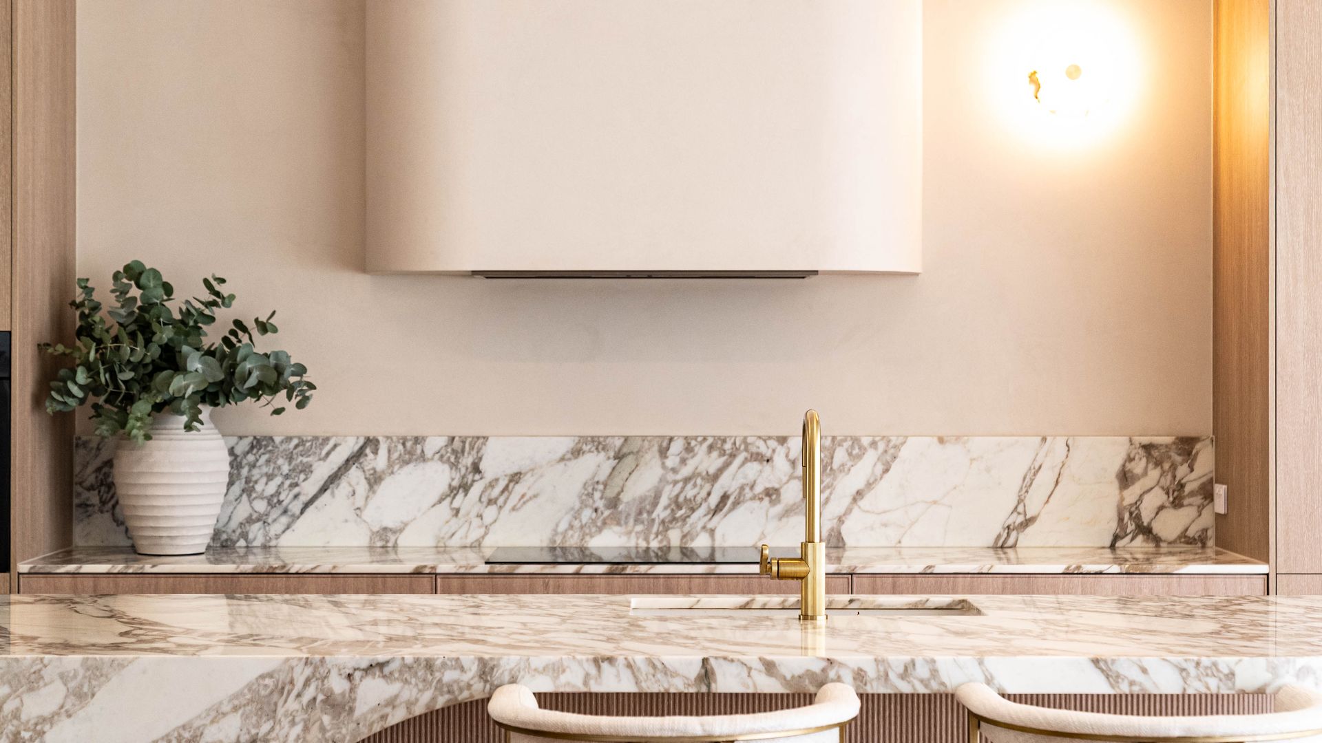A Kitchen Island and Backsplash With a Marbled Stone Surface — Elite Stone in Tweed Heads South, NSW