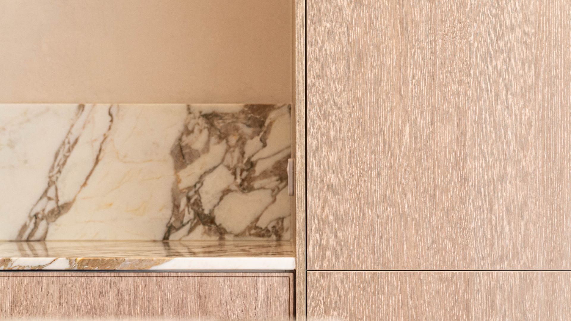 A Close-up of Kitchen Cabinet With Light Wood Grain, Featuring an Open Shelving Area — Elite Stone in Tweed Heads South, NSW