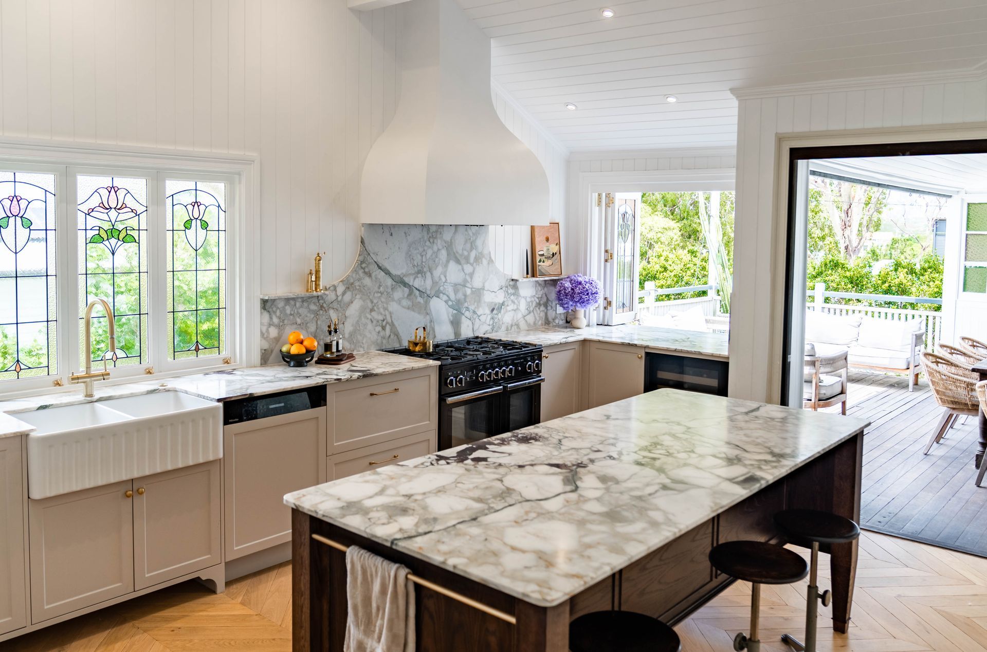 Bright, Modern Kitchen With Light Cabinetry, Marble Countertops, and Glass Windows — Elite Stone in Tweed Heads South, NSW
