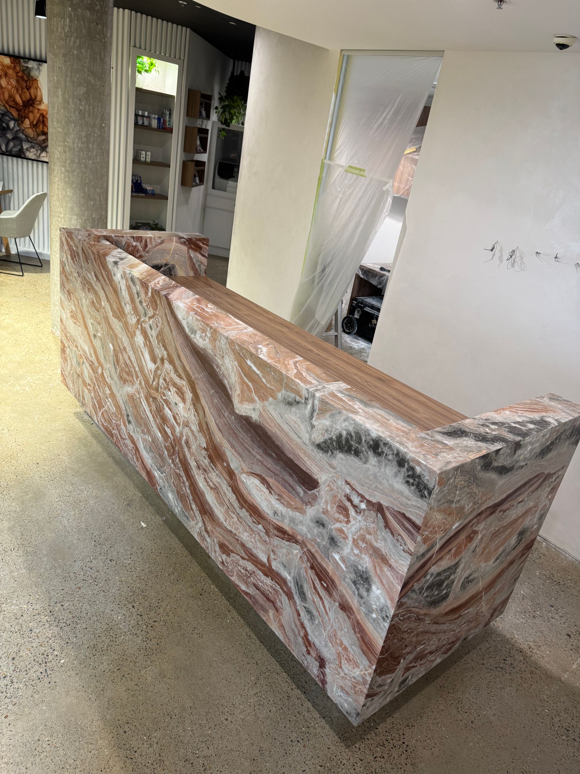 A kitchen with a marble counter top, stainless steel appliances — Elite Stone in Tweed Heads South, NSW