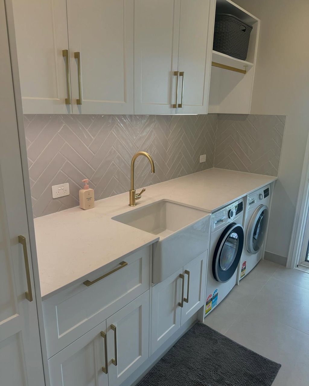 Bright Laundry Room With Stone Benchtops