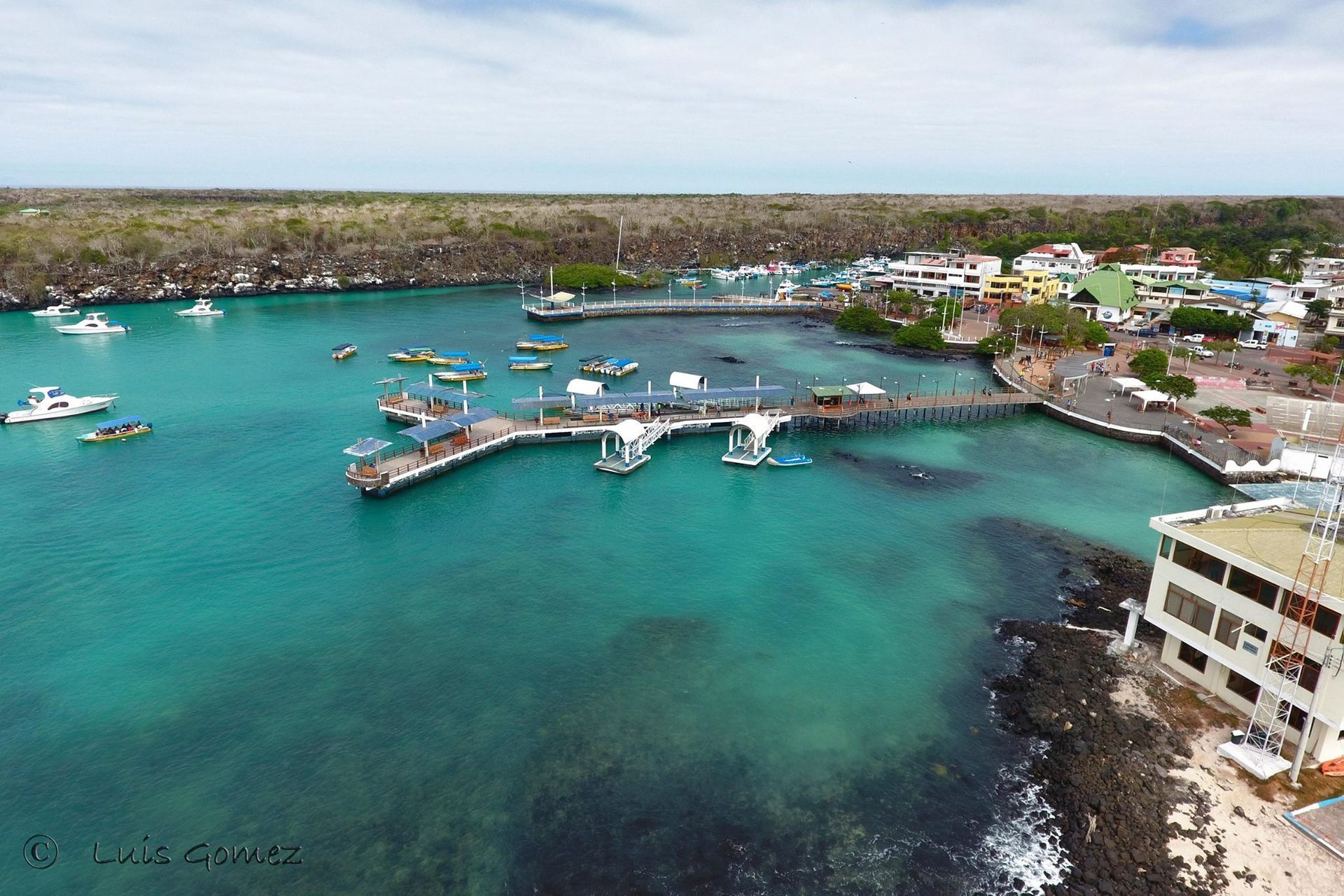 An aerial view of a harbor with boats in it