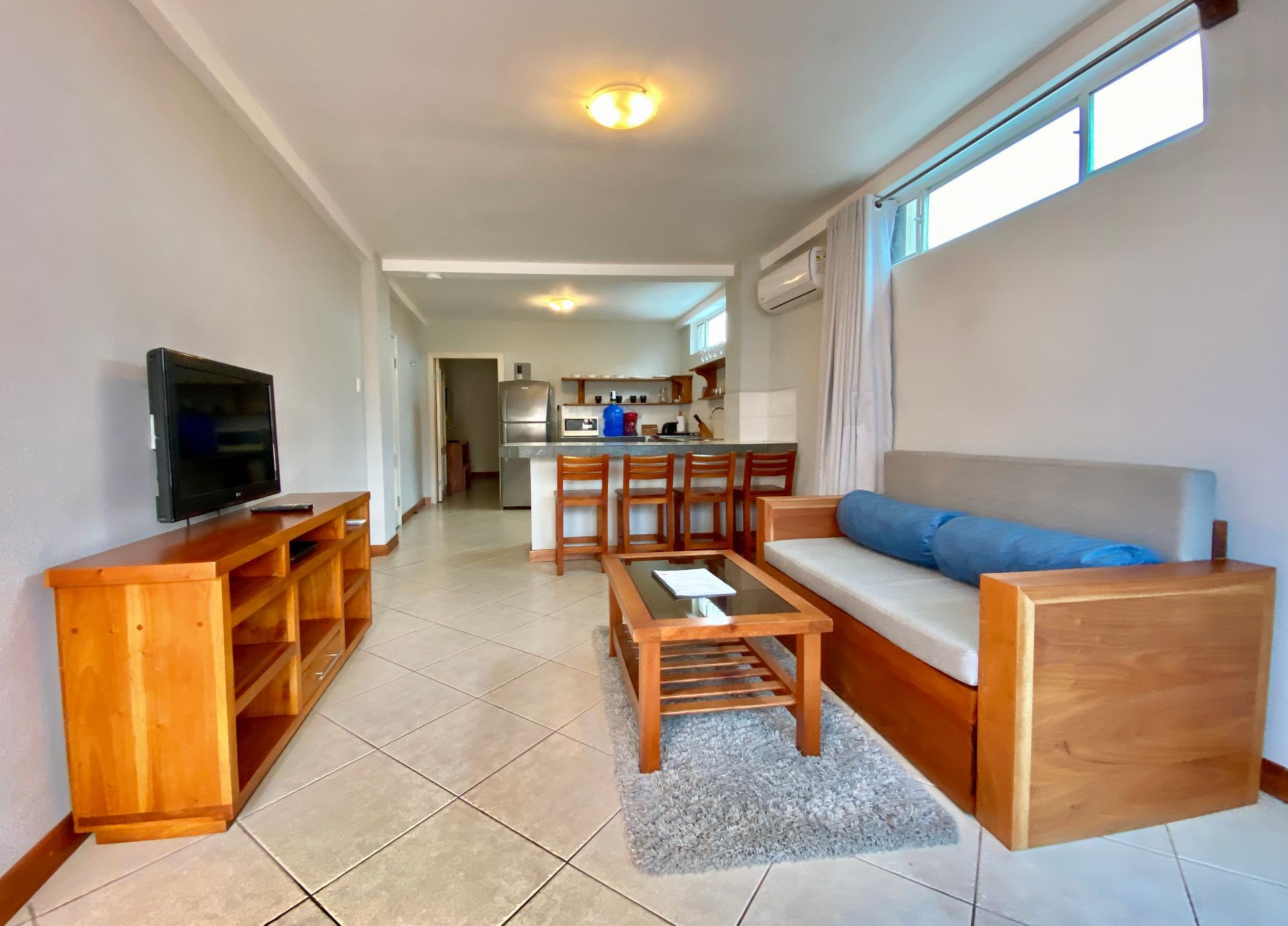A living room with a couch and a television