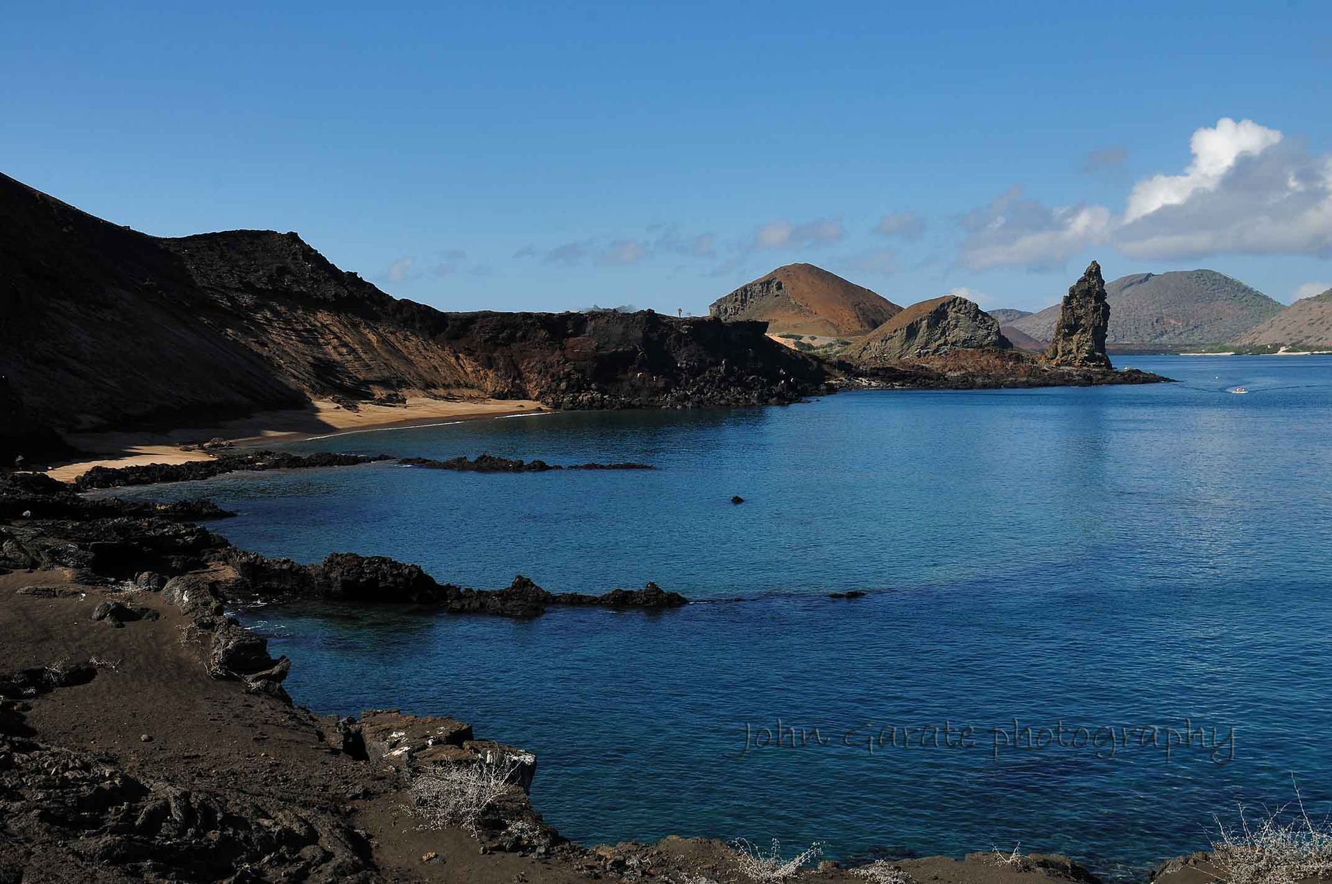 A large body of water with mountains in the background