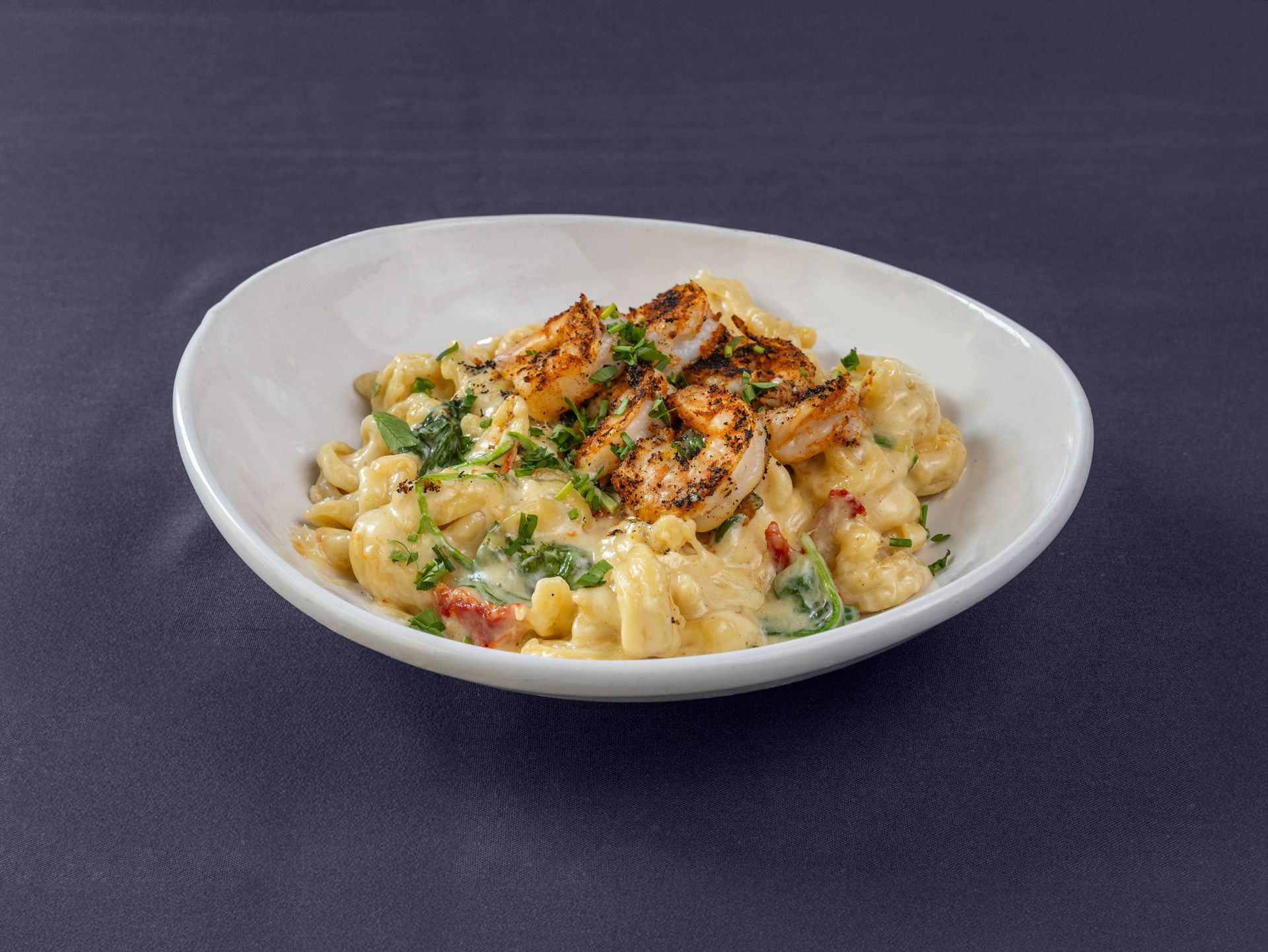 A plate of food with rice and asparagus on a table.