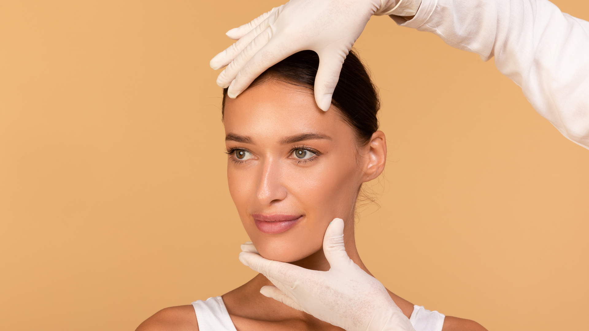 A woman is getting her face examined by a doctor.