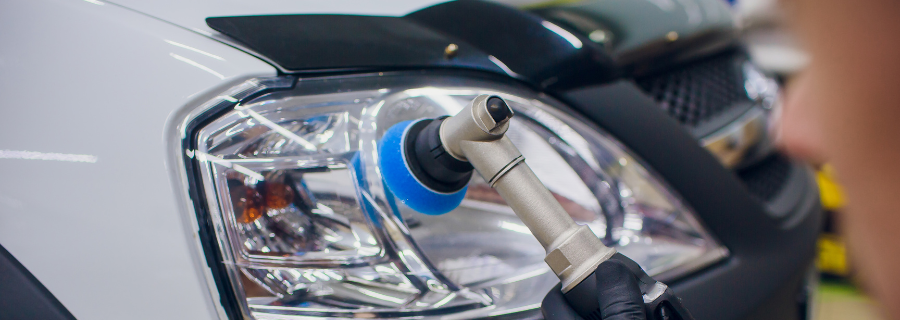 Close-up of a car’s charging port with an electric vehicle plug connected